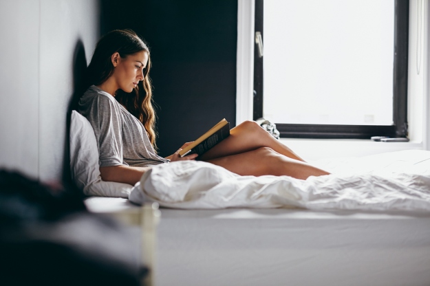 women-reading-bed-relaxed-book